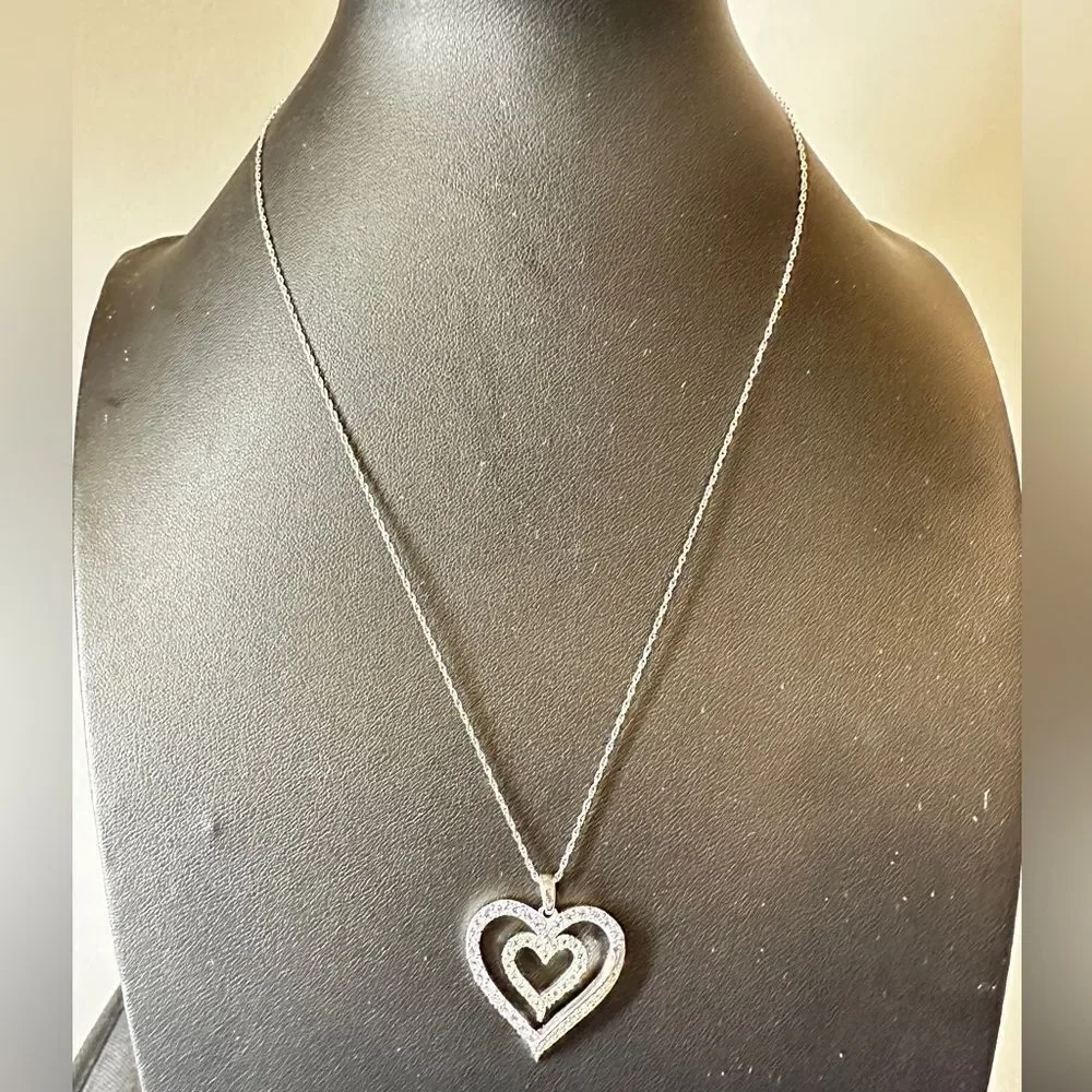 Genuine 1.5ctw tanzanite and‎ CZ accent heart necklace in sterling silver!